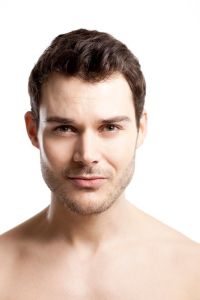 Confident man with healthy hair representing awareness of the seven stages of male pattern baldness