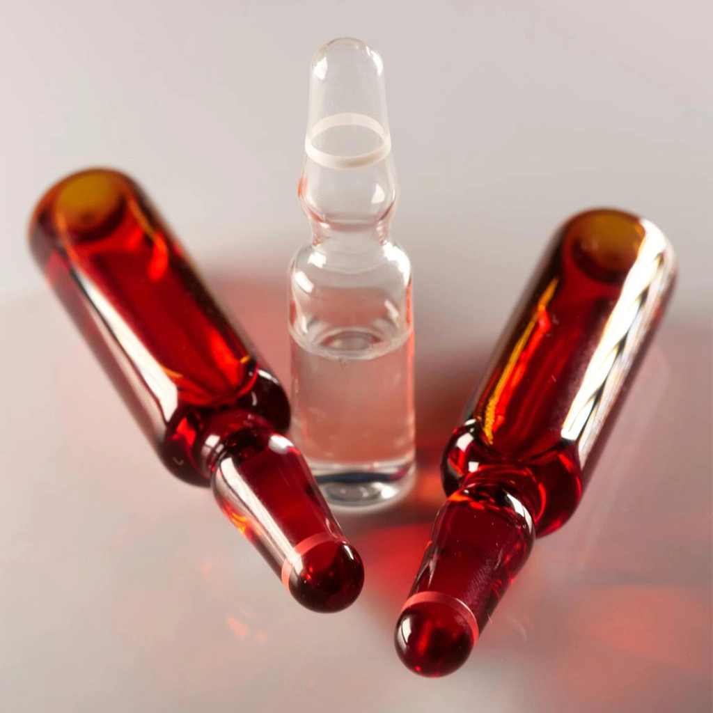 about face medical aesthetics closeup of red and clear empty vials