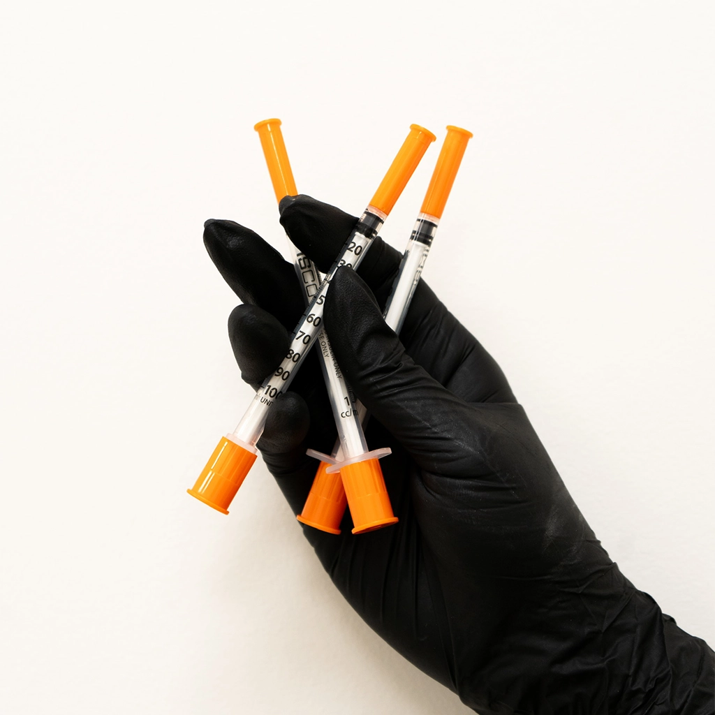 about face medical aesthetics hand holding injection needles